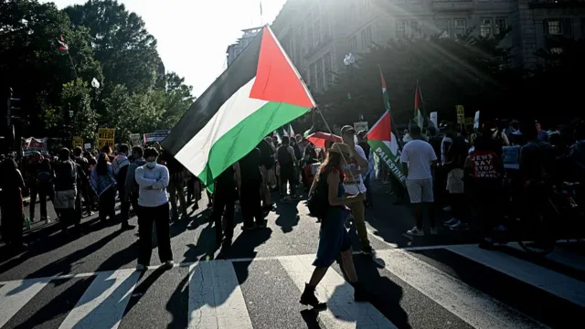 Protesters wave Palestinian flags during Benjamin Netanyahu's visit with Donald Trump in Washington D.C.