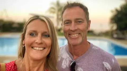 Craig and Lindsay Foreman, a carpenter and life coach, smile for a selfie