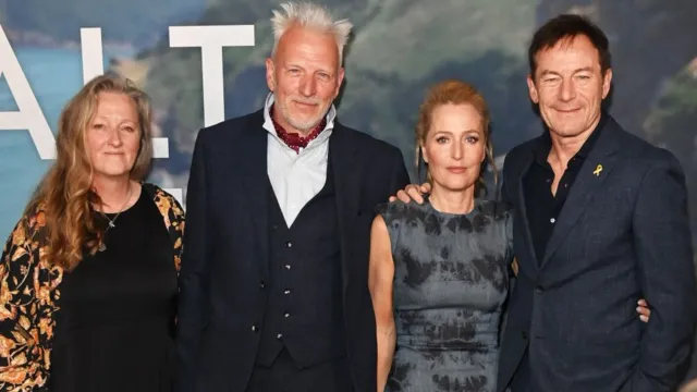 Raynor Winn and Moth Winn with Gillian Anderson and Jason Isaacs, who portrayed them in the film 'The Salt Path'