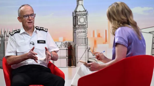 Metropolitan Police Commissioner Sir Mark Rowley speaking with Laura Kuenssberg