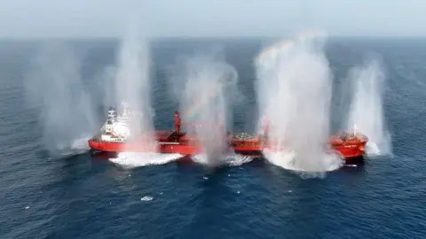 Video footage released by Yemen's Houthis appears to show explosive charges being detonated on the cargo ship Magic Seas after armed men boarded the vessel.