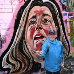 A Melbourne lane with a mural of Erin Patterson