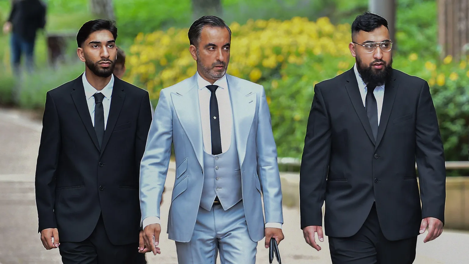 Human Rights lawyer Aamer Anwar arrives with Mohammed Fahir Amaaz and Muhammed Amaad at Liverpool Crown Court.
