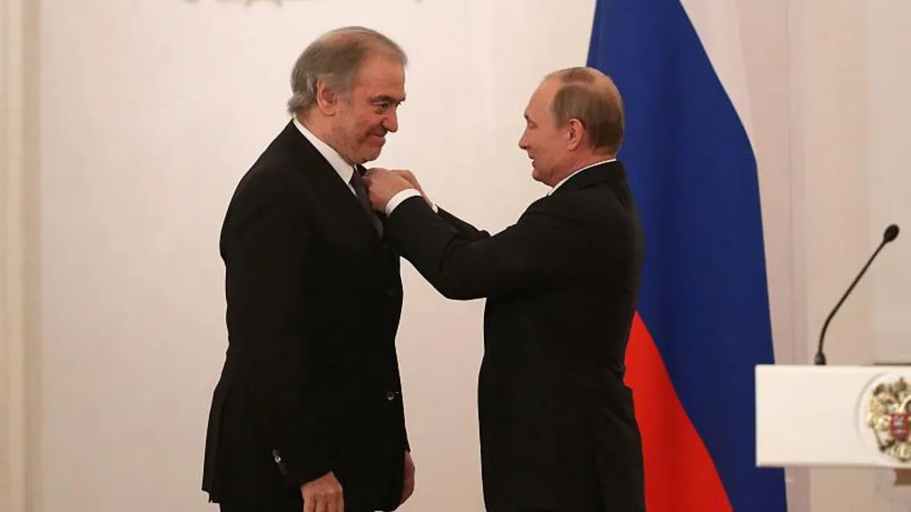 Russia's President Putin pins a medal on conductor Gergiev at the Kremlin in 2016