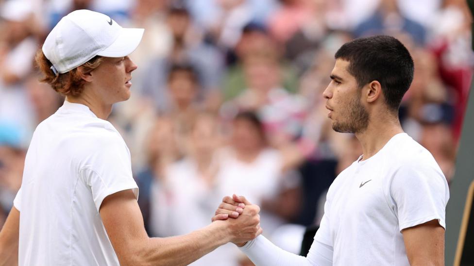 Jannik Sinner shakes hands with Carlos Alcaraz after their 2022 match at Wimbledon