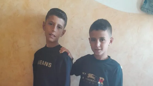 Nine-year-old Omar (right), pictured with his elder brother, died of his wounds in hospital