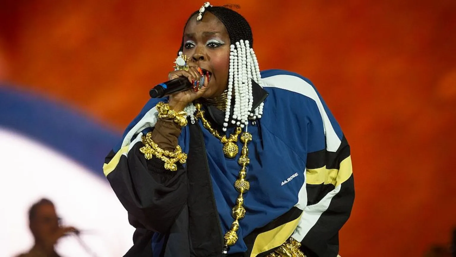 Getty Images Lauryn Hill performing in a blue jacket during Drake\'s set