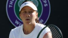 Amanda Anisimova in action during a tennis match.