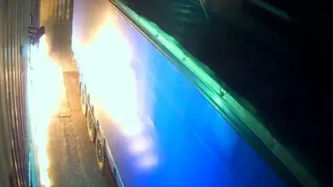 Security cameras captured the fire at the warehouse in Leyton, east London.