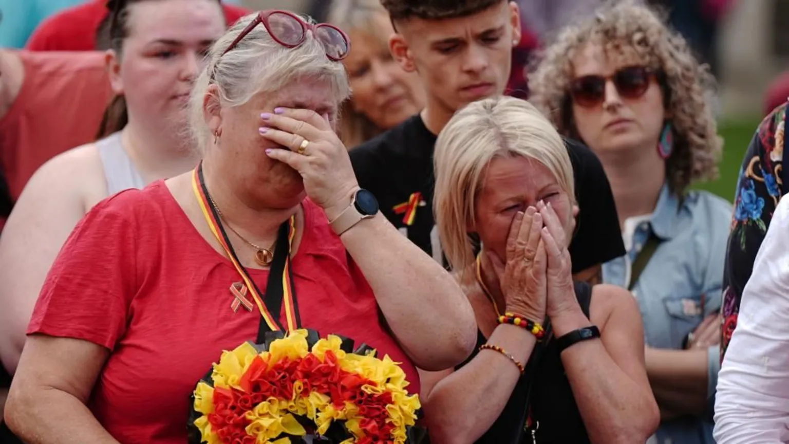 Campaigners holding a minute's silence in memory of those who died during the infected blood scandal.
