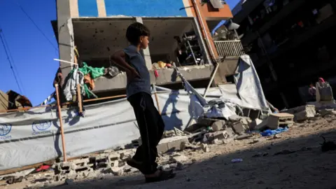 An overnight Israeli strike impacted a UN-run school in Gaza City, which was providing shelter to displaced individuals.