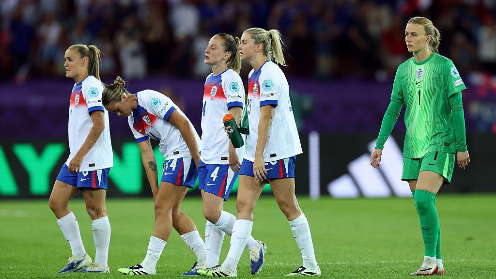 England players react to a missed opportunity during the match against France.