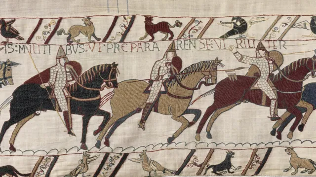 A scene from the Bayeux Tapestry depicting men on horseback, illustrating the 1066 Norman invasion and Battle of Hastings.