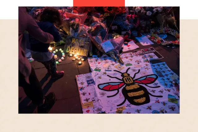 Flowers and balloons are placed in central Manchester on May 22, 2018, the one year anniversary of the deadly attack at Manchester Arena