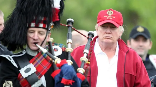 Donald Trump with a bagpiper in Scotland