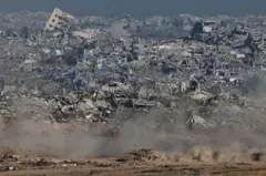 An Israeli tank moves in Gaza, as seen from the Israeli side of the border (6 July 2025)