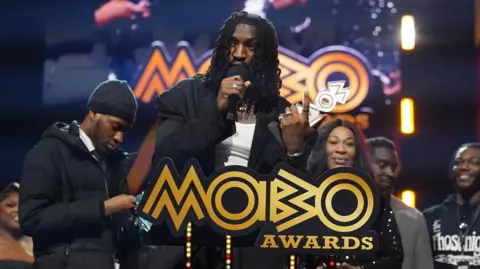 Odeal wins the Best R&B/Soul Act Award at the Mobo Awards