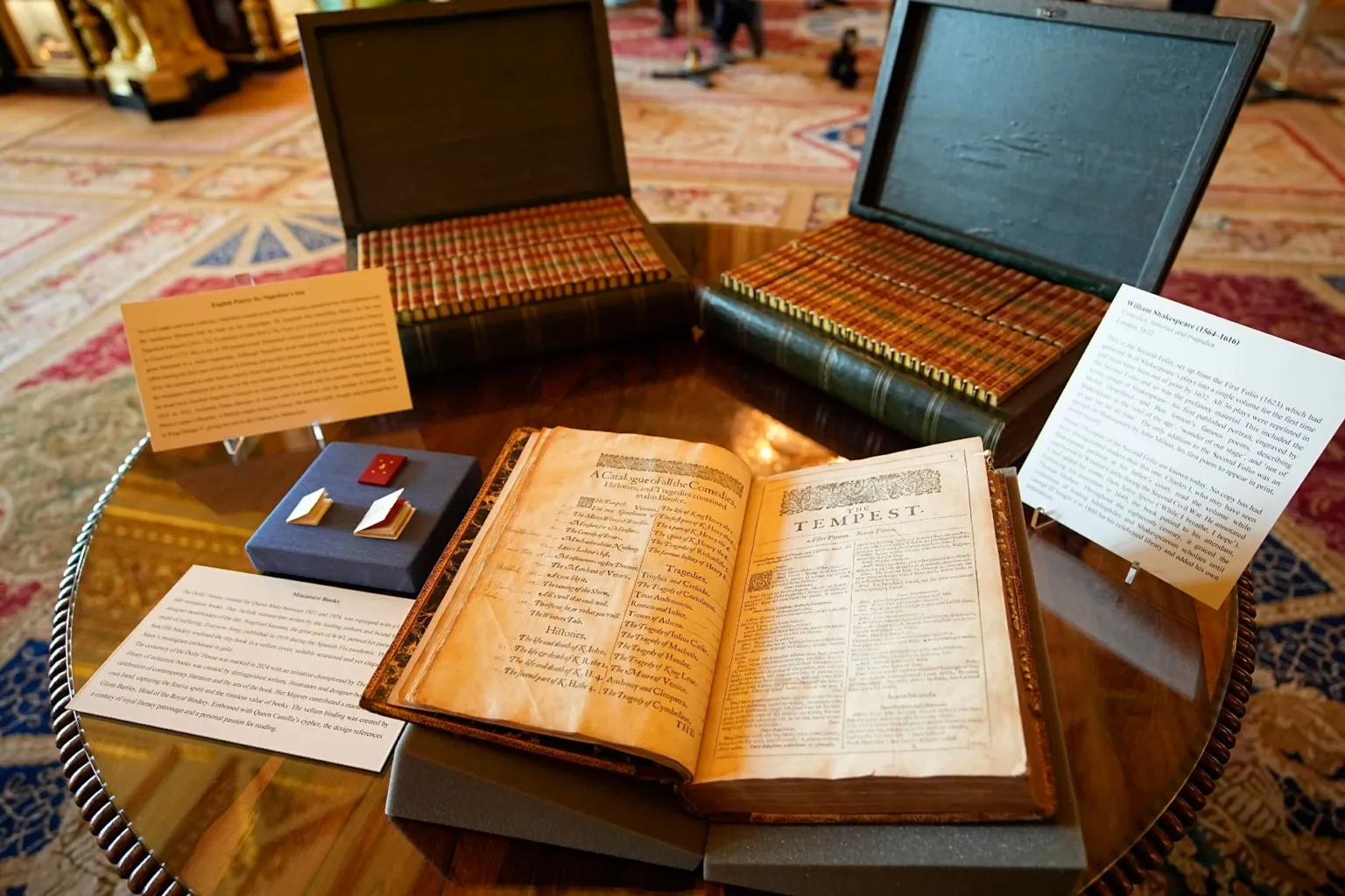 PA Media Two cases which lay open on a table contain volumes of books while on book is left opened with the title "The Tempest" clearly seen on one page.