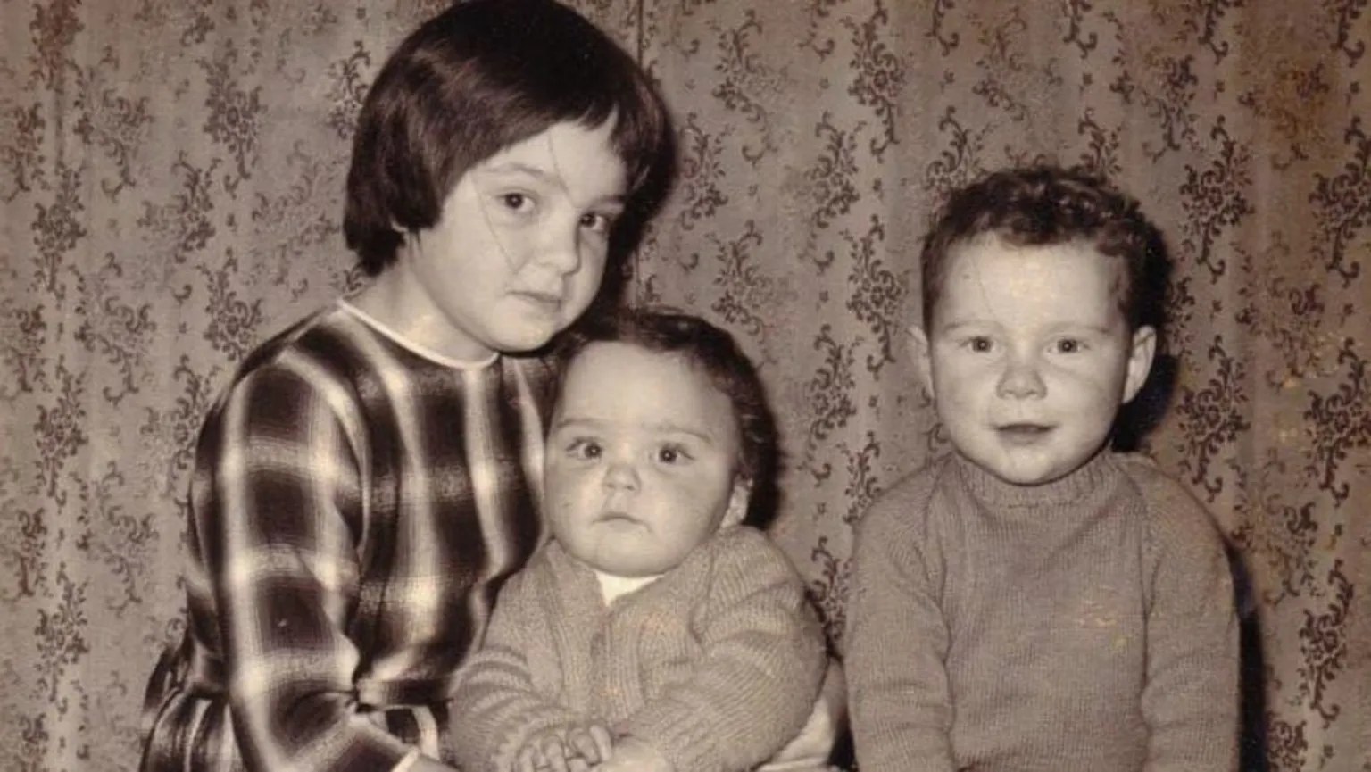 Alistair with his adoptive siblings, Janet and Andrew.