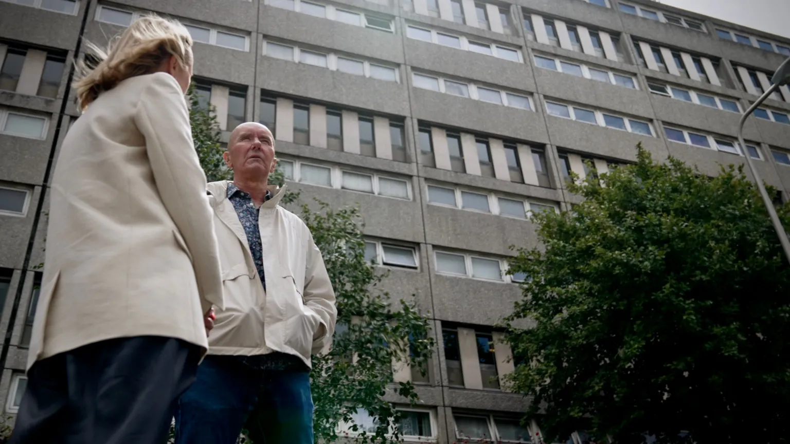 Irvine Welsh with journalist Katie Razzall outside the Banana Flats in Leith.