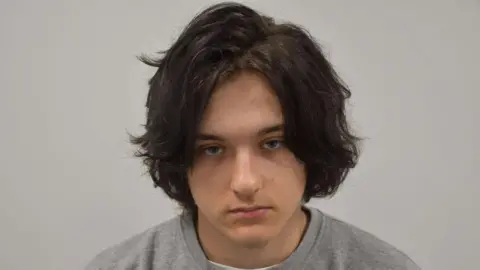 Ugnius Asmena, who was in the front passenger seat of the getaway car.