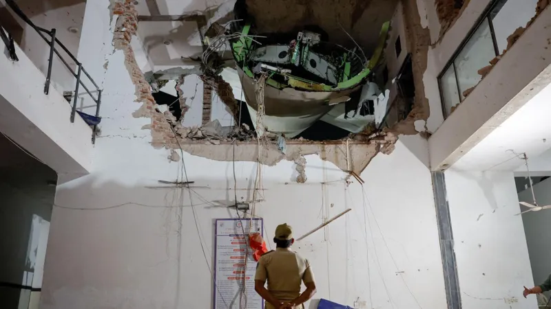 The Air India crash site, showing the impact on the doctors\' hostel.