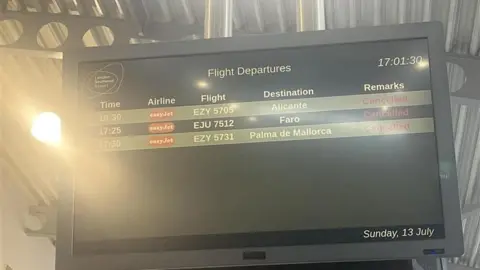 A screen at Southend Airport showing flight departures, with multiple flights listed as cancelled.