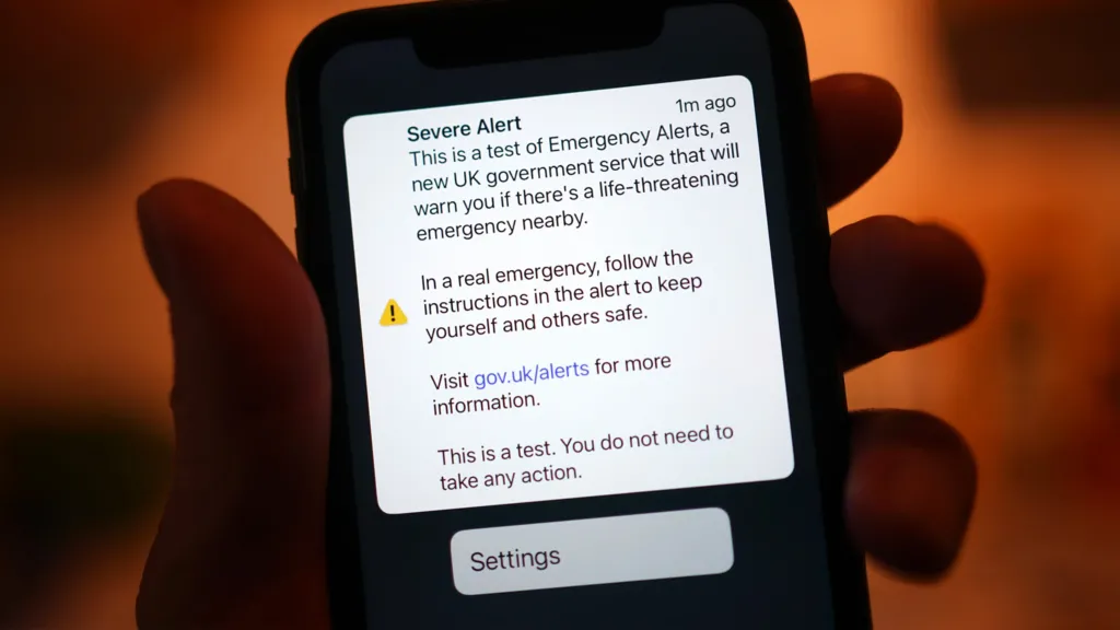 A mobile phone screen displaying a test emergency alert message.